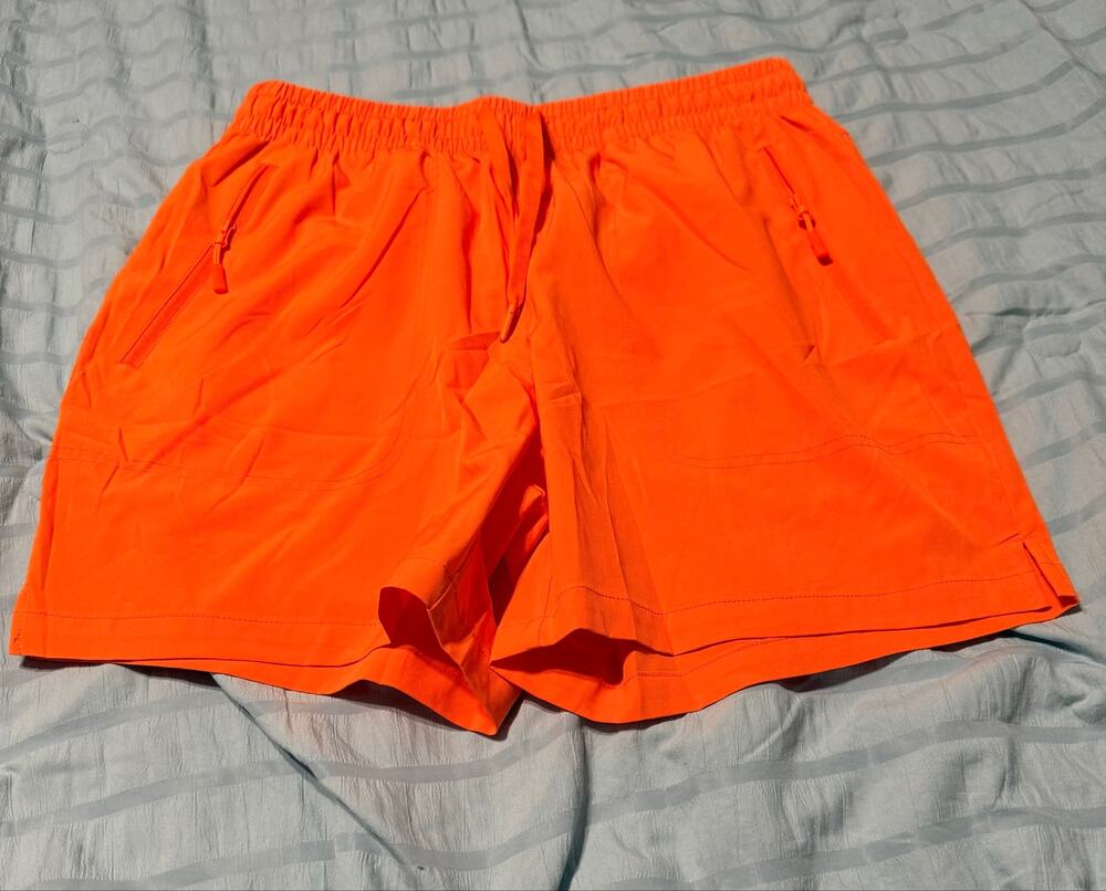 New pair of mens orange athletic shorts by the brand MAGCOMSEN Size XL